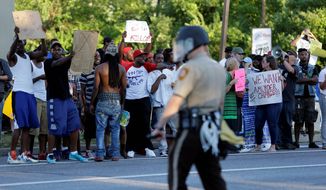 Many police departments are saying it is a mistake to agree to the states setting up independent review boards to evaluate police misconduct, such as the case of the shooting death of Michael Brown in Ferguson, Missouri, last summer. (Associated Press)