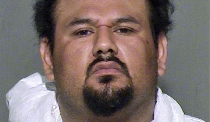 This undated law enforcement booking photo provided by the Maricopa County, Ariz., Sheriff&#x27;s Office shows Apolinar Altamirano. A surveillance video that captured the killing of a Phoenix-area convenience store clerk shows the suspect, Altamirano, calmly walking behind the counter after pulling the trigger, stepping over the fallen victim and grabbing several packs of Marlboros before slowly exiting. The chilling depiction was outlined in a court document Friday, Jan. 23, 2015, as a Maricopa County Superior Court judge set bail at $1 million. (AP Photo/Maricopa County Sheriff&#x27;s Office) ** FILE **