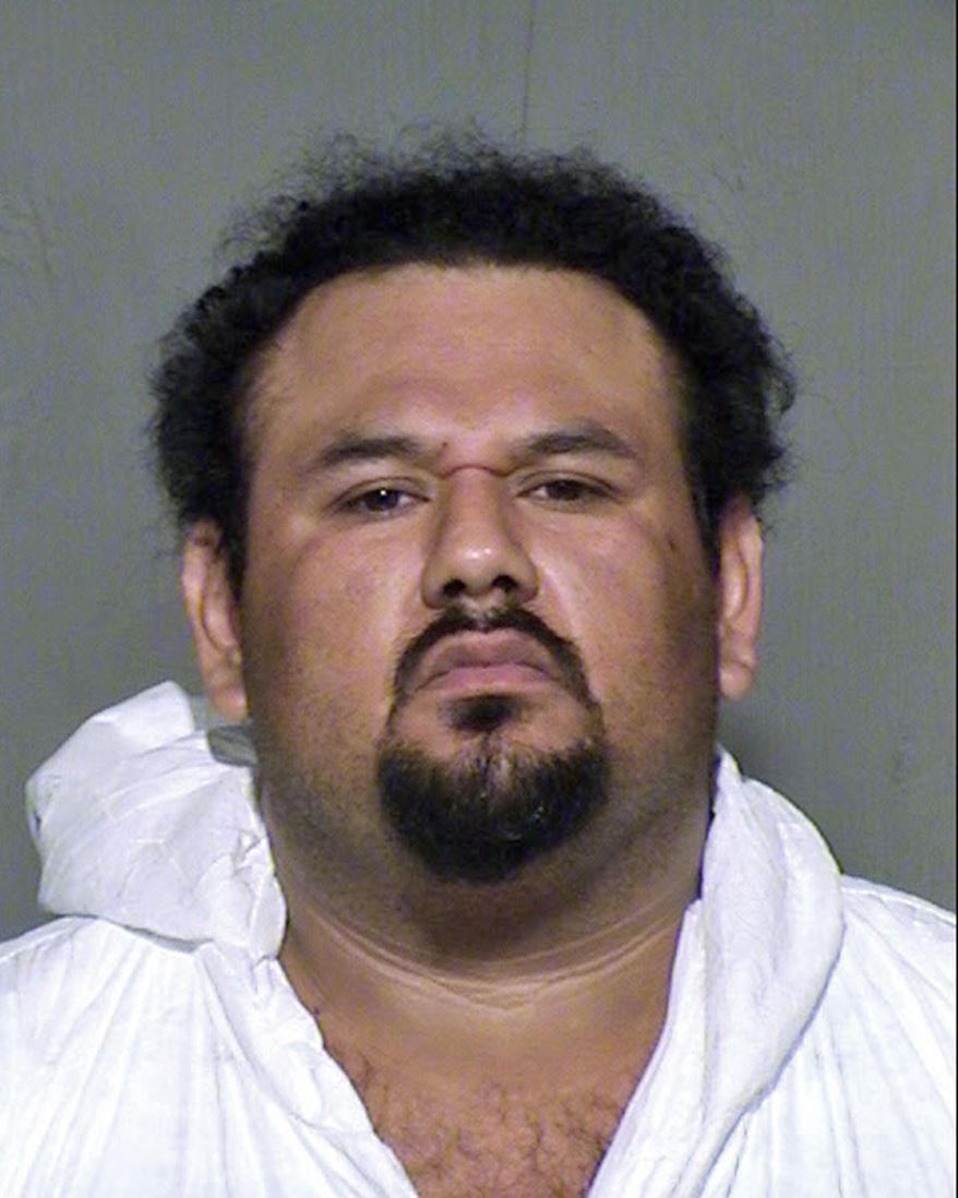 This undated law enforcement booking photo provided by the Maricopa County, Ariz., Sheriff&#39;s Office shows Apolinar Altamirano. A surveillance video that captured the killing of a Phoenix-area convenience store clerk shows the suspect, Altamirano, calmly walking behind the counter after pulling the trigger, stepping over the fallen victim and grabbing several packs of Marlboros before slowly exiting. The chilling depiction was outlined in a court document Friday, Jan. 23, 2015, as a Maricopa County Superior Court judge set bail at $1 million. (AP Photo/Maricopa County Sheriff&#39;s Office) ** FILE **