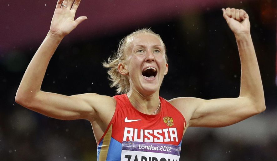 FILE - In this Aug. 6, 2012 file photo, Russia&#x27;s Yuliya Zaripova celebrates as she wins the women&#x27;s 3,000-meter steeplechase in the Olympic Stadium at the 2012 Summer Olympics in London. Zaripova faces a doping ban in the latest scandal to hit Russian athletics. Athletics&#x27; world governing body, the IAAF, told The Associated Press on Saturday, Jan. 24, 2015 that Zaripova is under suspicion under biological passport rules, a means to track extreme blood values which indicate doping. (AP Photo/Anja Niedringhaus, File)