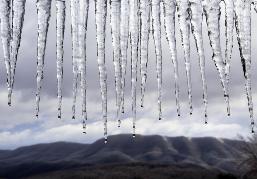 Icicles drip from the overhang of a picnic shelter at the Blacksburg Municipal "Hill" Golf Course after a winter storm in Blacksburg, Va. on Saturday, Jan. 24 2015. The National Weather Service has lifted a winter weather advisory for much of the Baltimore and Washington areas. But the advisory remains in effect until noon for western Maryland, western Virginia and points to the north.(AP Photo / The Roanoke Times, Matt Gentry)