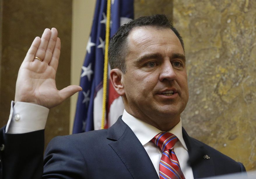Greg Hughes is sworn in as Speaker of the House at the Utah State Capitol Monday, Jan. 26, 2015, in Salt Lake City. Utah lawmakers kick off their legislative session on Monday as they prepared to devote the first week to preliminary budget meetings. Among the items they'll need to consider is a plan to relocate a state prison in Draper, whether or not they'll expand eligibility for Medicaid and a package of reforms to Utah's criminal justice system. (AP Photo/Rick Bowmer)