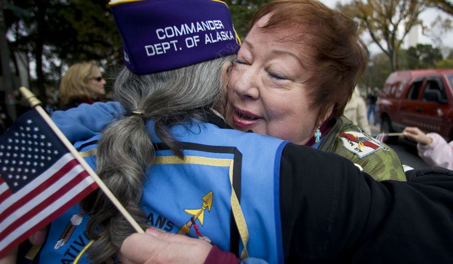 &quot;Donut Dollies&quot; member Kammy McCleery, is greeted with a hug by a Vietnam War veteran during a parade in Washington, Saturday, Nov. 10, 2007,  in commemoration of the Veterans Day, on Sunday. Donut Dollies served as a recreation worker with the American Red Cross in Vietnam.  (AP Photo/Manuel Balce Ceneta)