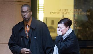 Former CIA officer Jeffrey Sterling leaves the Alexandria Federal Courthouse on Monday in Alexandria, Va., with his wife, Holly, after being convicted on all nine counts he faced of leaking classified details of an operation to thwart Iran&#39;s nuclear ambitions to a New York Times reporter. (Associated Press)
