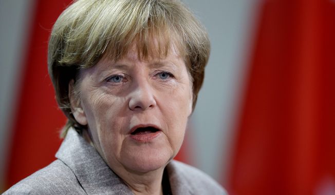 German Chancellor Angela Merkel said during a visit to Hungary on Monday that her nation will not provide military hardware to Ukraine and asserted that the war with Russia-backed forces &quot;cannot be solved militarily.&quot; (Associated Press)