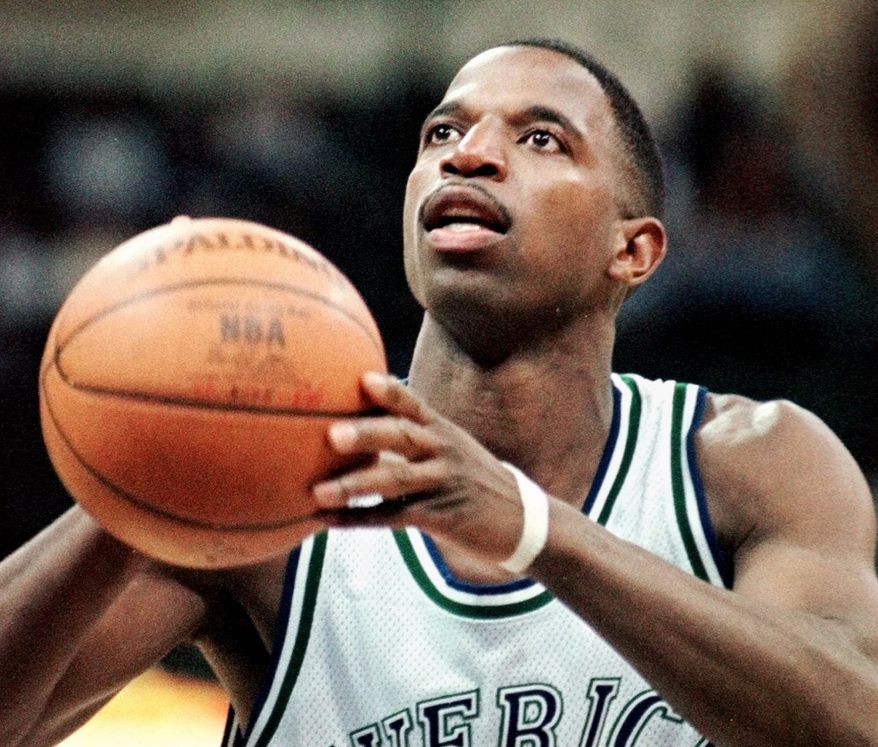 Dallas Mavericks forward A.C. green shoots a free throw during the fourth quarter against the Vancouver Grizzlies in Dallas, Saturday night, March 13, 1999. Green, who was playing in his 1,000th consecutive NBA game, scored 11 points in the Mavericks&#39; 91-74 win. (AP Photo/Bill Janscha)
