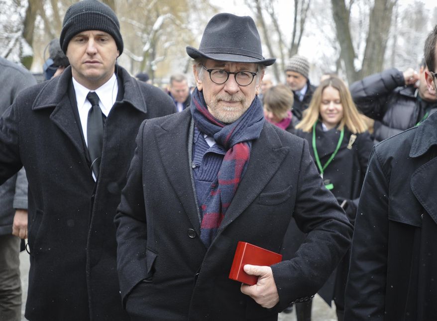 Film director Steven Spielberg leaves after attending the unveiling of a memorial plaque at the Auschwitz Nazi death camp in Oswiecim, Poland, Tuesday, Jan. 27, 2015. Some 300 Holocaust survivors traveled to Auschwitz for the 70th anniversary of the death camp's liberation by the Soviet Red Army in 1945, down from 1,500 who attended the event 10 years ago. (AP Photo/Alik Keplicz)