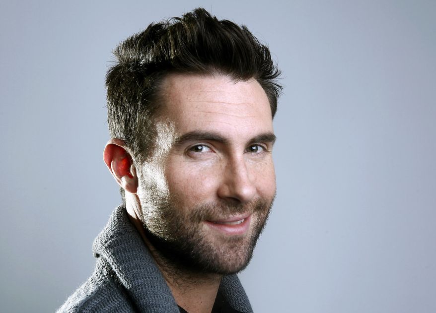 This Feb. 20, 2012, file photo shows Maroon 5 frontman Adam Levine in New York. (AP Photo/Carlo Allegri, File)