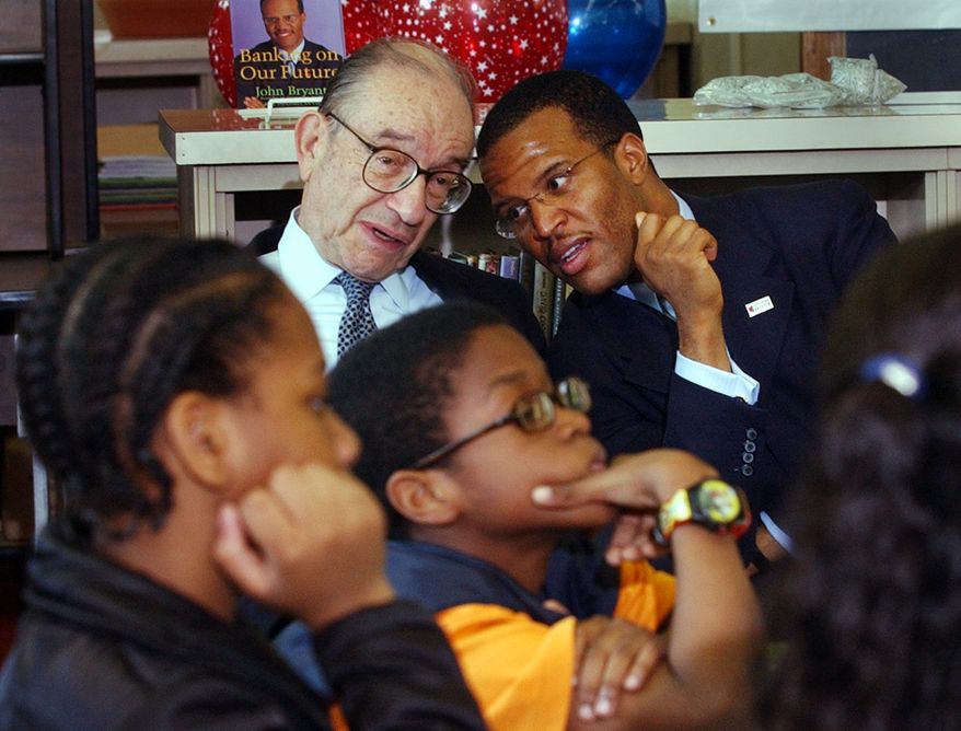 John Hope Bryant, right, founder/CEO of Operation HOPE, in 2003 with then-Federal Reserve Chairman Alan Greenspan and 6th grade students taking part in the non-profit's financial literacy program. (APPhotos/Susan Walsh)