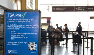 This undated image released by the Transportation Security Administration shows a sign promoting the TSA PreCheck program at at Reagan National Airport in Washington. (AP Photo/TSA) ** FILE **
