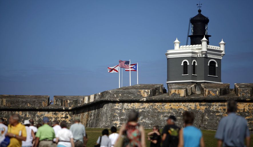 SAN JUAN P.R. -Tourists walk near the 16th century Spanish fort called El Morro in Old San Juan, Puerto Rico. There&#39;s an entrance fee to enter the Castillo San Felipe del Morro, but the best way to enjoy this U.S. National Historic Site requires no money at all. The fort that towers over San Juan Bay, known universally as just &amp;#8220;El Morro,&amp;#8221; is a great place to stroll, especially at sunset. The massive rolling expanse of grass at the foot of the fort has spectacular views in any direction. It&#39;s a popular place to picnic and fly a kite, sold by nearby street vendors. (AP Photo/Ricardo Arduengo, File)