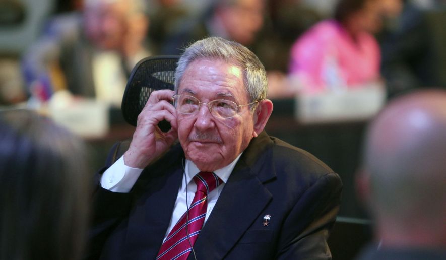 In this publicly distributed handout photo provided by the Presidency of the Republic of Costa Rica, Cuba&#39;s President Raul Castro listens on a headphone during the summit of the Community of Latin American and Caribbean States in San Antonio de Belen, Costa Rica, Wednesday, Jan. 28, 2015. (AP Photo/Presidency of the Republic of Costa Rica, Roberto Carlos Sanchez)