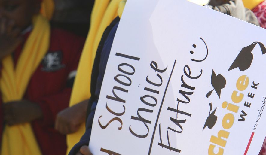 Eric Rose, 6, from Ellwood Christian Academy, in Selma, participates in a National School Choice Week rally at the Alabama State Capitol, Wednesday Jan. 28, 2015, in Montgomery, Ala. Parents and students rallied on the lawn of the Alabama Capitol Wednesday, urging state politicians to provide more publicly funded education options.(AP Photo/Hal Yeager)