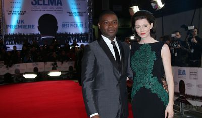 Actor David Oyelowo and wife Jessica pose for photographers at a central London cinema, Tuesday, Jan. 27, 2015, for the European premiere of Selma, a film about a three month campaign led by Martin Luther King Jr, which culminated in a march from Selma to Montgomery, Alabama, USA. (Photo by Joel Ryan/Invision/AP)