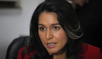 Rep. Tulsi Gabbard, Hawaii Democrat, speaks during a meeting at Gujarat Chamber of Commerce and Industry (GCCI) in Ahmadabad, India, on Dec. 27, 2014. (Associated Press) **FILE**