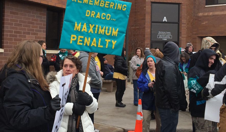 Dozens of protesters rally outside the Sherburne County Courthouse for a Minnesota man accused of videotaping himself as he tortured and killed his girlfriend's dog in Elk River, Minn., Wednesday, Jan. 28, 2015. Anthony Sather made a brief appearance in Sherburne County court Wednesday. Sather faces a felony count of mistreating an animal. (AP Photo/The Star Tribune, Jennifer Brooks) MANDATORY CREDIT; ST. PAUL PIONEER PRESS OUT; MAGS OUT; TWIN CITIES TV OUT