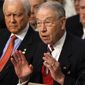 Senate Judiciary Committee Chairman Sen. Charles E. Grassley, Iowa Republican (right), sitting next to Sen. Orrin Hatch, Utah Republican, helped pass a new restitution bill for victims of child pornography. (AP Photo/Jacquelyn Martin)