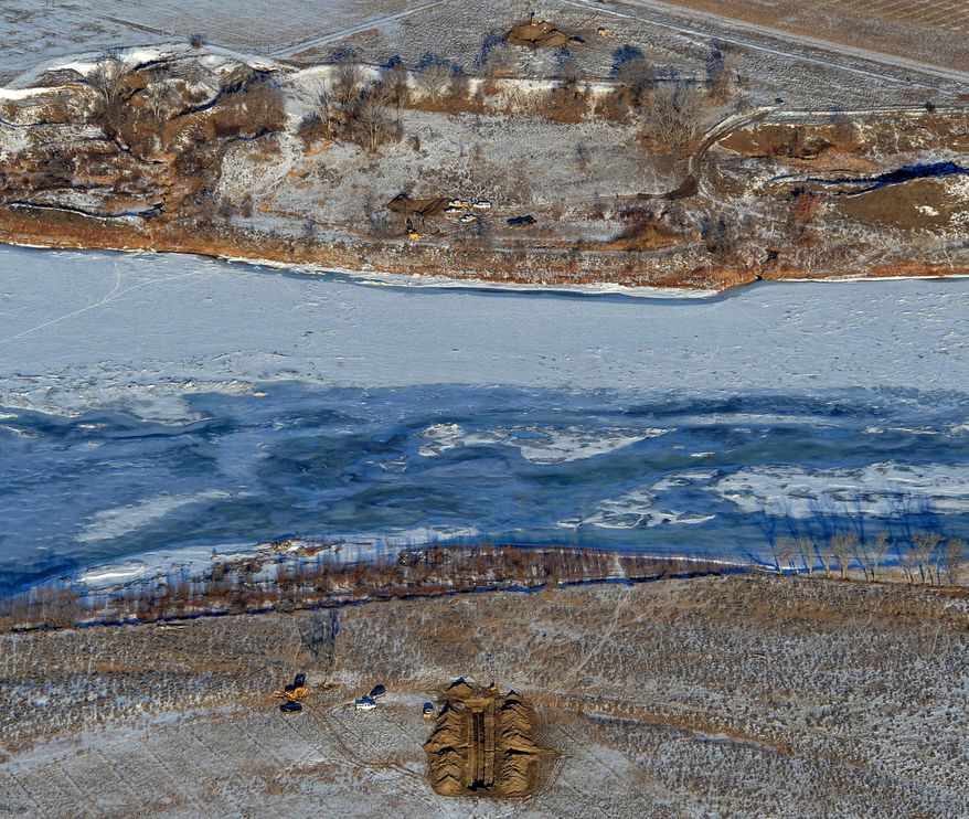 FILE-This Jan. 19, 2015 file photo crews work to contain an oil spill from Bridger Pipeline&#39;s broken pipeline near Glendive, Mont., in this aerial view showing both sides of the river. Oil pipeline accidents have spiked in the U.S. as Congress pushes for approval of the Keystone XL pipeline from Canada, a project that would pass not far from where 30,000 gallons of crude spilled earlier this month into Montana’s Yellowstone River. (AP Photo/The Billings Gazette, Larry Mayer,File)