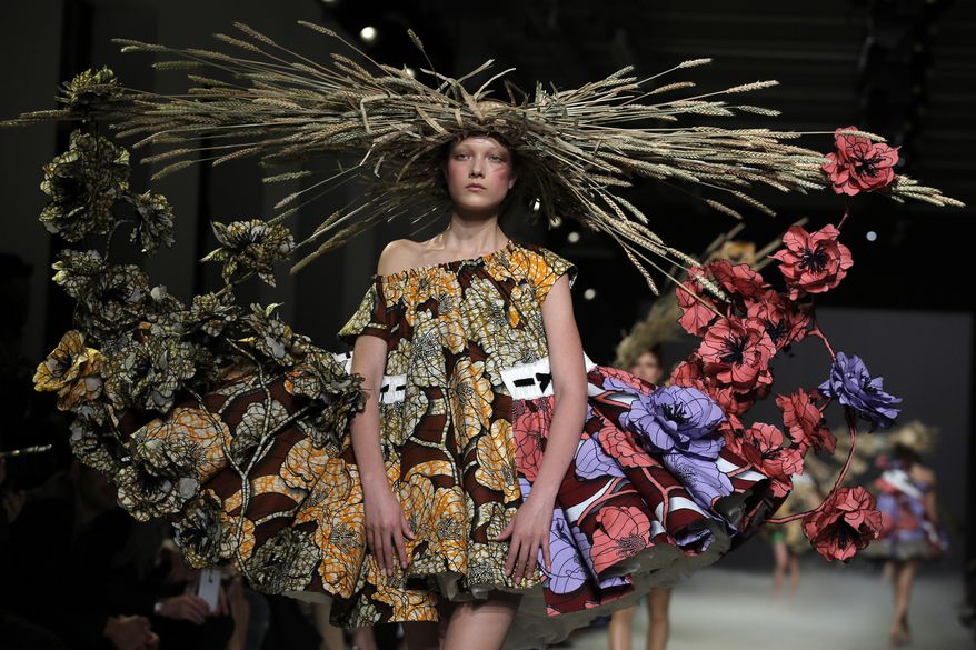 A model wears a creation by designers Viktor Horsting and Rolf Snoeren as part of their Viktor and Rolf's Spring-Summer 2015 Haute Couture fashion collection, presented in Paris, France, Wednesday, Jan 2015. (AP Photo/Francois Mori)