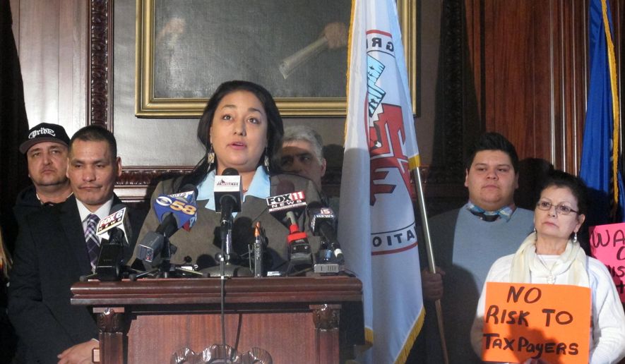 Menominee Tribe Vice Chair Crystal Chapman-Chevalier joins with union workers and a bipartisan group of state lawmakers to urge Gov. Scott Walker to reconsider his rejection of a Kenosha casino on Thursday, Jan. 29, 2015, in Madison, Wis. (AP Photo/Scott Bauer)