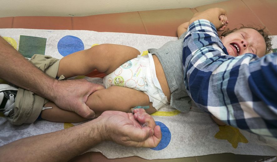 Pediatrician Charles Goodman vaccinates 1-year-old Cameron Fierro with the measles-mumps-rubella vaccine, or MMR vaccine at his practice in Northridge, Calif., on Jan. 29, 2015. Some doctors are adamant about not accepting patients who don&#39;t believe in vaccinations, with some saying they don&#39;t want to be responsible for someone&#39;s death from an illness that was preventable. (Associated Press)