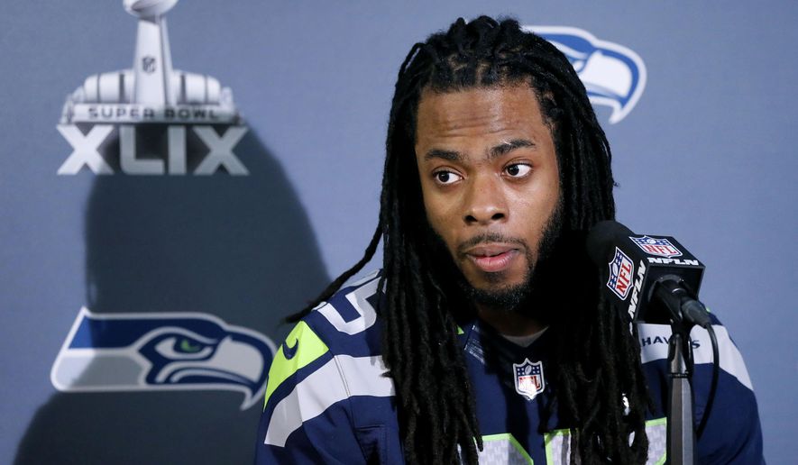 Seattle Seahawks&#x27; Richard Sherman answers a question at a news conference for NFL Super Bowl XLIX football game, Wednesday, Jan. 28, 2015, in Phoenix. The Seahawks play the New England Patriots in Super Bowl XLIX on Sunday, Feb. 1, 2015. (AP Photo/Matt York)