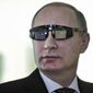 Russian President Vladimir Putin wears special glasses as he visits a research facility of the St. Petersburg State University in St. Petersburg, Russia, on Monday, Jan. 26, 2015. In televised comments after a meeting with students in St. Petersburg, President Vladimir Putin said that Ukraine&amp;#8217;s army was at fault for the increase in violence and accused it of using civilians as &amp;#8220;cannon fodder&amp;#8221; in the conflict. &amp;#8220;(Ukraine&amp;#8217;s army) is not even an army, it&amp;#8217;s a foreign legion, in this case a foreign NATO legion,&amp;#8221; Putin said. &amp;#8220;They have totally different goals, connected to the geopolitical containment of Russia, which absolutely do not coincide with the national interests of the Ukrainian people.&amp;#8221; (AP Photo/RIA Novosti Kremlin, Mikhail Klimentyev, Presidential Press Service)