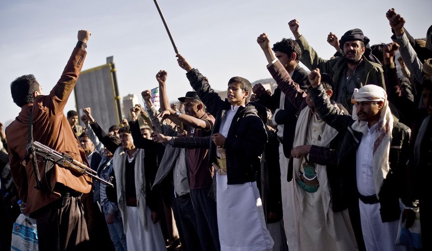 Houthi Shiite Yemenis chant slogans during a rally to show support for their comrades in Sanaa, Yemen, Wednesday, Jan. 28, 2015. Rebels who control the Yemeni capital have beaten back dozens of people marching in protest against them, firing automatic rifles in the air and striking protesters with batons and knives. (AP Photo/Hani Mohammed)