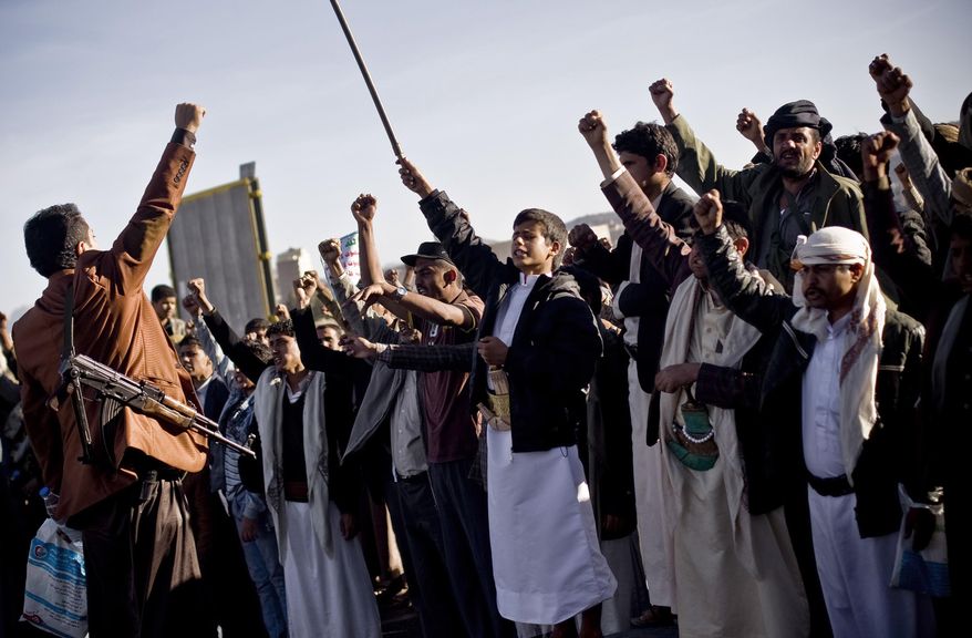 Houthi Shiite Yemenis chant slogans during a rally to show support for their comrades in Sanaa, Yemen, Wednesday, Jan. 28, 2015. Rebels who control the Yemeni capital have beaten back dozens of people marching in protest against them, firing automatic rifles in the air and striking protesters with batons and knives. (AP Photo/Hani Mohammed)