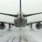 A United Airlines jet blows snow on a runway at O&#39;Hare International Airport, Sunday, Feb. 1, 2015, in Chicago. More than 1,100 flights have been canceled at Chicago&#39;s airports and snow-covered roads are making travel treacherous. (AP Photo/Nam Y. Huh)