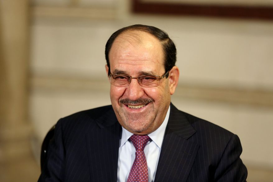 Iraq's Vice President and former Prime Minister Nouri al-Maliki, smiles during an interview with The Associated Press in Baghdad, Iraq, Monday, Feb. 2, 2015. Al-Maliki denies he is seeking a political comeback despite frequent appearances in local media and a recent high-profile visit to influential neighboring Iran. (AP Photo/Khalid Mohammed)