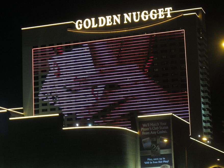 This Aug. 31, 2012 photo shows the exterior of the Golden Nugget casino in Atlantic City N.J. In an action made public on Tuesday, Feb. 3, 2015, the New Jersey Division of Gaming Enforcement fined the casino $4,000 for handing a gambler a stack of chips to reimburse his losses after the casino realized it had used unshuffled cards for four games. Chips cannot be removed from gambling tables except in return for cash, credit or in other narrowly defined circumstances. (AP Photo/Wayne Parry)
