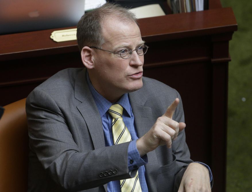 Rep. Kraig Powell, R-Heber City, gestures on the house floor at the Utah State Capitol Tuesday, Feb. 3, 2015, in Salt Lake City. Powell has revived a proposal to raise the age for legal tobacco purchases to 21 despite the bill’s failure in the Senate last year. (AP Photo/Rick Bowmer)