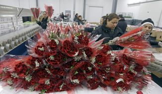 Workers prepare flowers for distribution to local merchants in preparation for Valentine&#39;s Day, at the South Florida Logistics Center in Miami, Tuesday, Feb. 3, 2015. (AP Photo/Alan Diaz) **FILE**