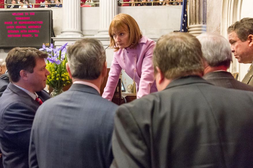 House Speaker Beth Harwell, R-Nashville, confers with colleagues and staff in the House chamber in Nashville, Tenn., on Wednesday, Feb. 4, 2015, before a Senate committee voted to defeat Gov. Bill Haslam's proposal to expand Medicaid in the state. (AP Photo/Erik Schelzig)