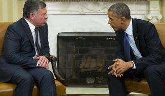 President Barack Obama, right, meets with  King Abdullah II of Jordan in the Oval Office of the White House, on Tuesday, Feb. 3, 2015, in Washington. The meeting comes after Jordanian Air Force pilot First Lt. Moaz al-Kasasbeh was executed by the Islamic State group. (AP Photo/Evan Vucci)