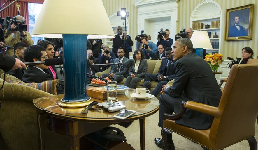 President Barack Obama meets with a group of &quot;Dreamers&quot; in the Oval Office of the White House in Washington on Feb. 4, 2015. (Associated Press **FILE**