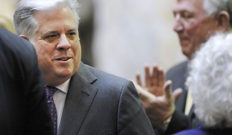 Maryland Gov. Larry Hogan greets state lawmakers before delivering his State of the State address Wednesday, Feb. 4, 2015, in Annapolis, Md. Hogan outlined plans for tax relief, charter schools and reforms to the state&#39;s legislative redistricting process. (AP Photo/Steve Ruark)