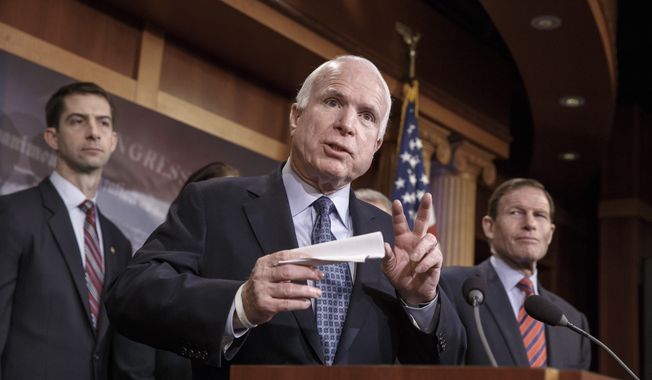 Senate Armed Services Committee Chairman Sen. John McCain, R-Ariz., flanked by Sen. Tom Cotton, R-Ark., left, and Sen. Richard Blumenthal, D-Conn., speaks during a news conference on Capitol Hill in Washington, Thursday, Feb. 5, 2015, where he gathered a bipartisan group of senators to call on American support for Ukraine, which needs weaponry to stave off incursion from Russia and Ukrainian separatists. (AP Photo/J. Scott Applewhite) ** FILE **