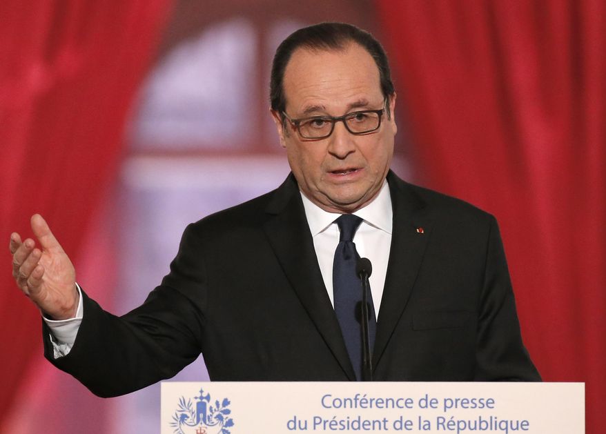 French President Francois Hollande answers a reporter during a press conference at the Elysee Palace in Paris, France, Thursday, Feb.5, 2015. French president says he and German chancellor Angela Merkel will head to Ukraine today with new peace initiative. Hollande said the two will head to Moscow the following day with a proposal "based on the territorial integrity of Ukraine." (AP Photo/Francois Mori)