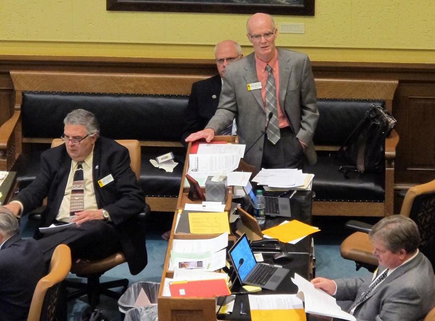 State Sen. Michael Von Flatern, R-Gillette, speaks on the floor of the Wyoming State Senate in Cheyenne, Wyo., Friday, Feb. 6, 2015. He was the sponsor of a Medicaid expansion bill that the Senate voted down. (AP Photo/Ben Neary)