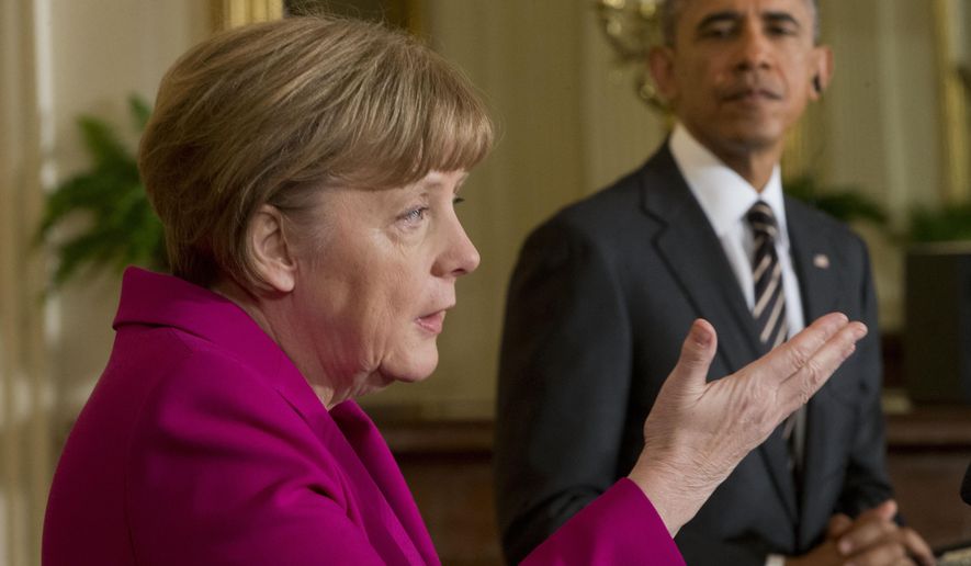 President Barack Obama listens as German Chancellor Angela Merkel speaks during their joint news conference in the East Room of the White House in Washington, Monday, Feb. 9, 2015. The leaders were expected to discuss the ongoing conflict in Ukraine, and arming Ukrainian fighters to wage a more effective battle against Russian-backed separatists. (AP Photo/Pablo Martinez Monsivais)