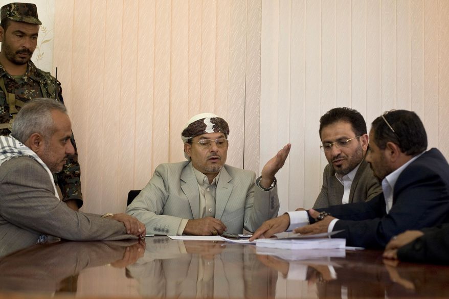 Yahya al-Houthi, center, brother of Houthi leader, Abdel-Malek al-Houthi attends a meeting at parliament in Sanaa, Yemen, Monday, Feb. 9, 2015. Yemen's Shiite rebels are meeting with political rivals for the first time since cementing their power grab last week by dissolving parliament and making their top security body the de facto government. (AP Photo/Hani Mohammed)