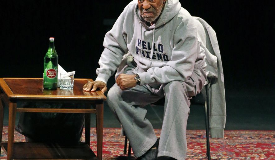FILE - In this Jan. 17, 2015 file photo, comedian Bill Cosby performs at the Buell Theater in Denver. Cosby is scheduled to perform his comedy routine at Boston's Wilbur Theater Sunday, Feb. 8, 2015. He faces sexual assault accusations from several women, with some of the claims dating back decades. He has denied the allegations through his attorney and has never been charged with a crime. (AP Photo/Brennan Linsley, File)