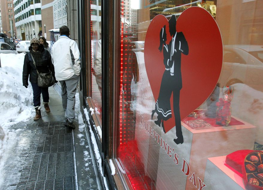 No matter what the weather, couples can find new, even "quirky" ways to show their affection to each other. (AP Photo/Bill Sikes)