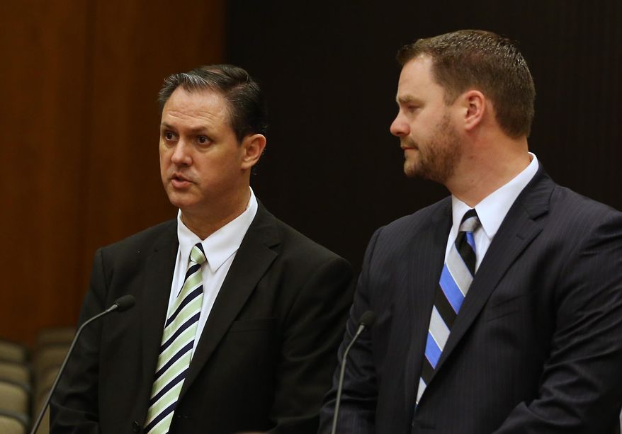 Former state employee Bryan Thurmond, left, appears in Sacramento County Superior Court with his attorney, John Holbus for an arraignment on a misdemeanor charge of bringing a loaded gun to work last month at the secretary of state's office, in Sacramento, Calif., Wednesday, Feb. 11, 2015. Thurmond, 51, did not enter a plea. (AP Photo/Rich Pedroncelli)