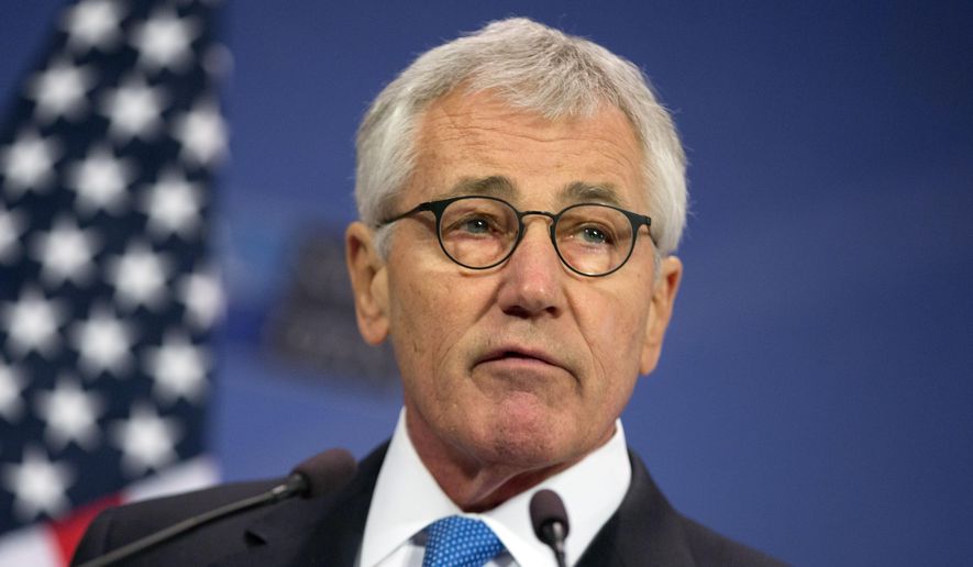 Then-U.S. Secretary of Defense Chuck Hagel speaks during a media conference at NATO headquarters in Brussels in this Feb. 5, 2015, file photo. (AP Photo/Virginia Mayo) ** FILE **