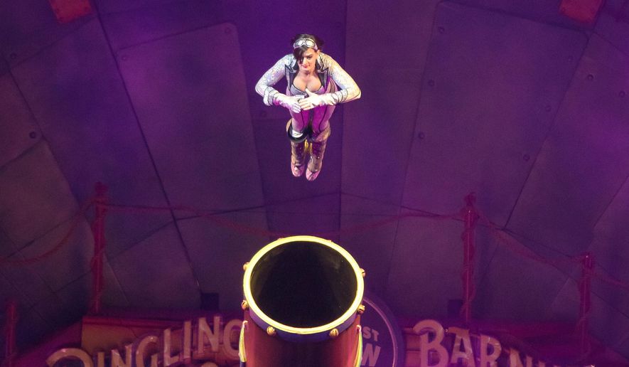 This image released by Feld Entertainment shows Gemma Kirby, the 25-year-old human cannonball during a performance at Circus Xtreme where she hurtles out of a cannon at up to 66 mph and lands up to 104 feet away in an air bag. Kirby will be celebrating a special milestone on Saturday: She's expected to notch her 500th total flight in Philadelphia. (AP Photo/Feld Entertainment)