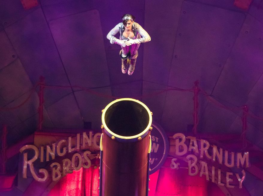 This image released by Feld Entertainment shows Gemma Kirby, the 25-year-old human cannonball during a performance at Circus Xtreme where she hurtles out of a cannon at up to 66 mph and lands up to 104 feet away in an air bag. Kirby will be celebrating a special milestone on Saturday: She's expected to notch her 500th total flight in Philadelphia. (AP Photo/Feld Entertainment)