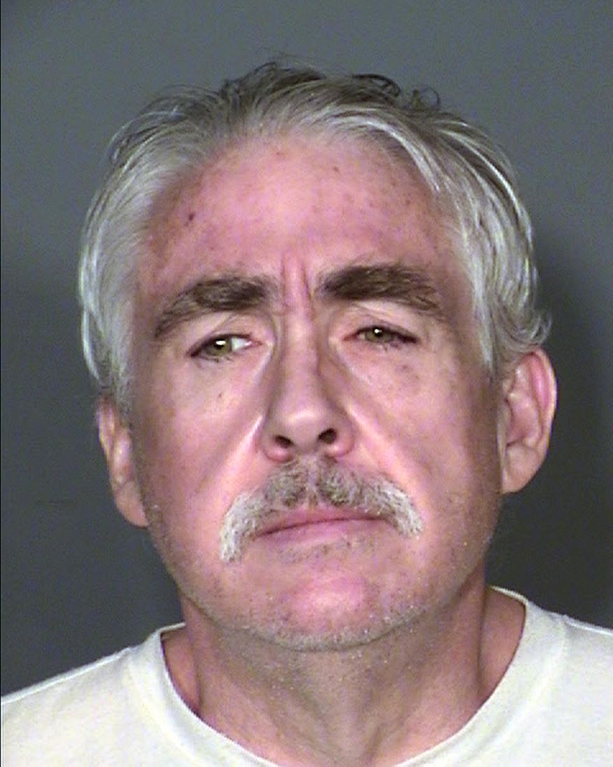 This undated booking photo provided by Clark County Detention Center shows Robert Dixon Dunn, 52, who is is scheduled for arraignment, Thursday, Feb. 12, 2015, in Las Vegas, on charges that he killed a couple, hid their bodies in a storage unit for more than 10 years and stole their Social Security benefits. (AP Photo/Clark County Detention Center)